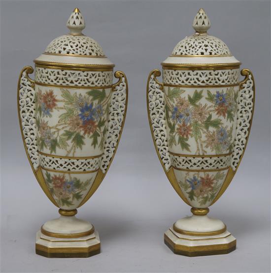 A pair of of Grainger Worcester lidded vases